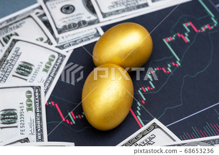 Golden eggs and dollar bank note isolated on Bar graph background Golden eggs and dollar bank note isolated on Bar graph background 68653236