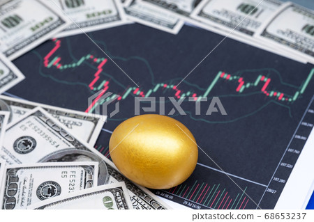 Golden eggs and dollar bank note isolated on Bar graph background Golden eggs and dollar bank note isolated on Bar graph background 68653237