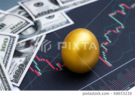 Golden eggs and dollar bank note isolated on Bar graph background Golden eggs and dollar bank note isolated on Bar graph background 68653238