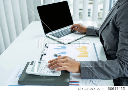 Business woman analyzed the chart for Setting challenging business goals and ready to achieve target 68653435