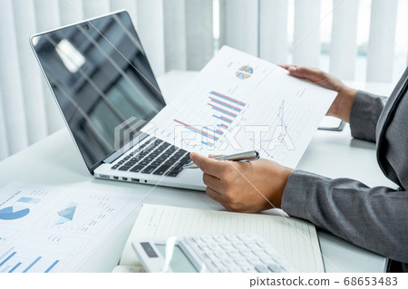 Business woman analyzed the chart for Setting challenging business goals and ready to achieve target 68653483