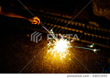 Enjoy the hand-held fireworks while avoiding the honey 68653495