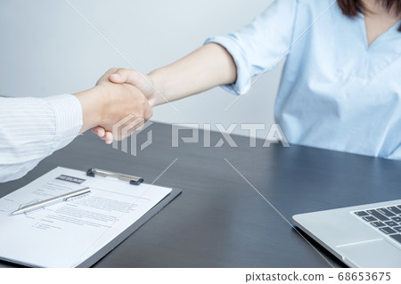 hands shake after business office executives are interviewing job applicants in the meeting room hands shake after business office executives are interviewing job applicants in the meeting room 68653675