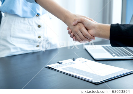 hands shake after business office executives are interviewing job applicants in the meeting room hands shake after business office executives are interviewing job applicants in the meeting room 68653864