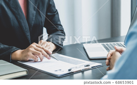 Business office executives are interviewing job applicants in the meeting room Business office executives are interviewing job applicants in the meeting room 68653901
