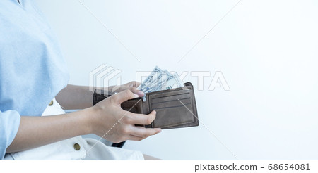 women person hands open the wallet and take purse dollar note out of 68654081