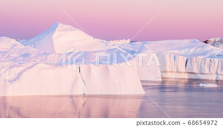 Iceberg from glacier in arctic nature landscape on Greenland - aerial photo 68654972