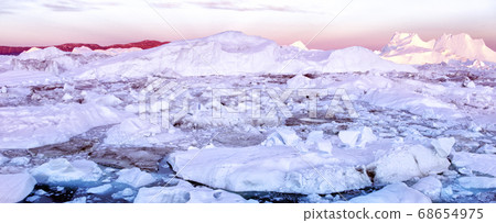 Iceberg and ice from glacier in arctic nature landscape on Greenland 68654975