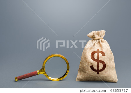 Dollar money bag and magnifying glass. Financial audit. Origin of capital and legality of funds. Search and attraction of financing. Find high-paying job. Most favorable conditions for deposits, loans Dollar money bag and magnifying glass. Financial audit. Origin of capital and legality of funds. Search and attraction of financing. Find high-paying job. Most favorable conditions for deposits, loans 68655717