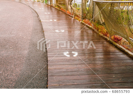 View of footprint sign for stand in lift. Social 68655793