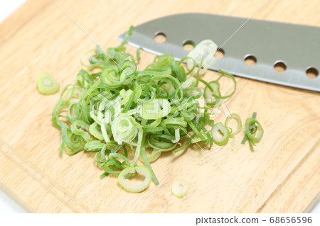 Chopped leeks on a cutting board Chopped leeks on a cutting board 68656596