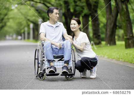 A woman who sits close to a man sitting in a... - Stock Photo [68658276 ...