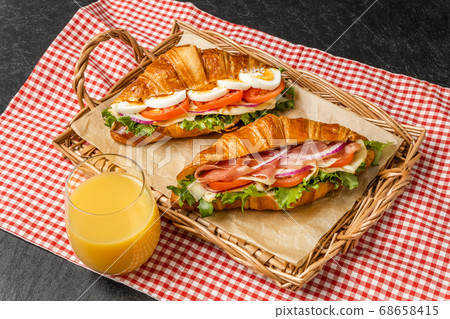 Croissant ham sandwich with cheese 68658415