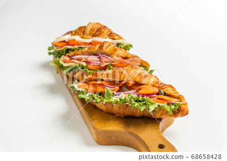 Croissant ham sandwich with cheese 68658428