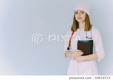 Woman doctor with white coat in hospital Woman doctor with white coat in hospital 68658723