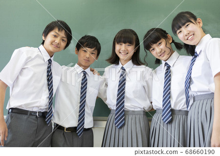Junior high school students and teachers lined up in front of the blackboard Junior high school students and teachers lined up in front of the blackboard 68660190