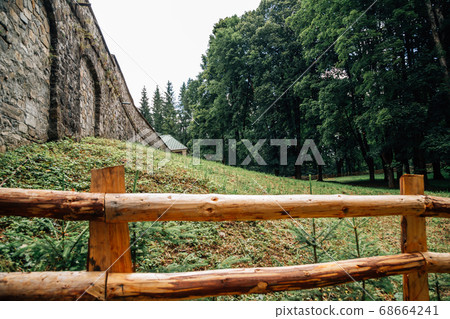 Sinaia hiking road with green forest in Romania 68664241
