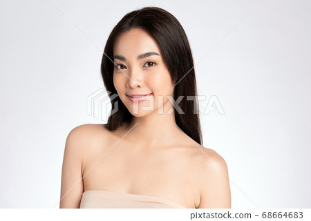 Beautiful Young asian Woman with Clean Fresh Skin, on white background, Face care, Facial treatment. Beautiful Young asian Woman with Clean Fresh Skin, on white background, Face care, Facial treatment. 68664683