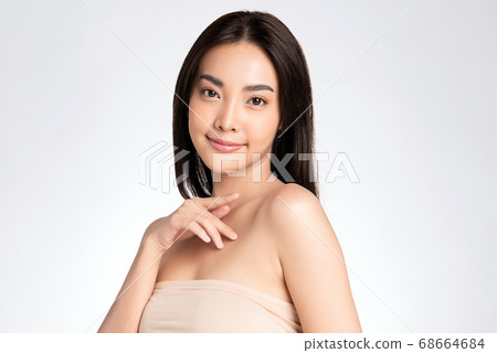 Beautiful Young asian Woman with Clean Fresh Skin, on white background, Face care, Facial treatment. Beautiful Young asian Woman with Clean Fresh Skin, on white background, Face care, Facial treatment. 68664684