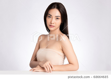 Beautiful Young asian Woman with Clean Fresh Skin, on white background, Face care, Facial treatment. Beautiful Young asian Woman with Clean Fresh Skin, on white background, Face care, Facial treatment. 68664685