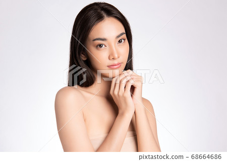 Beautiful Young asian Woman with Clean Fresh Skin, on white background, Face care, Facial treatment. 68664686
