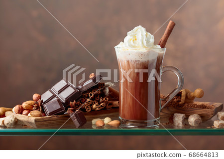 Cocoa with cream, cinnamon, chocolate pieces and Cocoa with cream, cinnamon, chocolate pieces and 68664813
