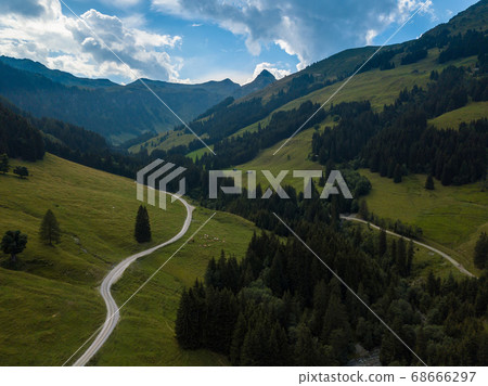 Aerial view into the valley head of the Hinterglemm Mountains on a summer day in the Alps at Saalbach-Hinterglemm, Austria 68666297