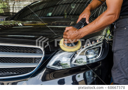 Man hands holding the work tool polish the Man hands holding the work tool polish the 68667378