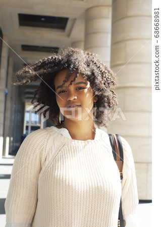 young pretty african girl posing cheerful on city background, lifestyle outdoor people concept young pretty african girl posing cheerful on city background, lifestyle outdoor people concept 68668981