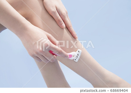 Woman doing unwanted hair processing 68669404