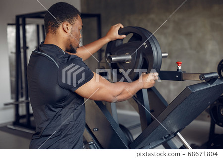 A handsome black man is engaged in a gym 68671804