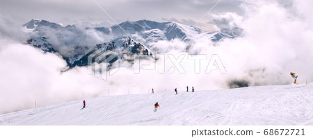 Saalbach, Austria ski slope and snow peaks panorama Saalbach, Austria ski slope and snow peaks panorama 68672721