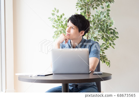 Young men working in free space Young men working in free space 68673565