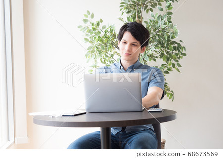 Young men working in free space Young men working in free space 68673569