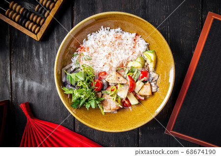Steamed rice with roasted chicken and vegetables Steamed rice with roasted chicken and vegetables 68674190
