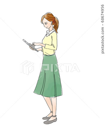 A woman operating a tablet A woman operating a tablet 68674956