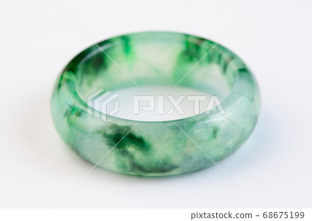 Texture of jadeite ring on white background 68675199