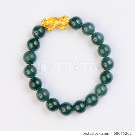 Green jade bracelet on white background Green jade bracelet on white background 68675202