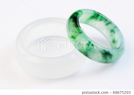 Group of white and green jadeite ring on white background Group of white and green jadeite ring on white background 68675203