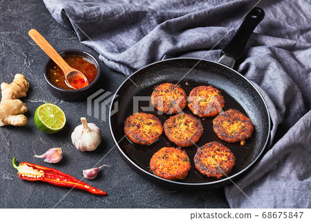 fried thai fish cakes on a skillet 68675847