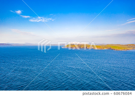 Aerial view of Dunmore head with Portnoo and Inishkeel island in County Donegal - Ireland 68676084