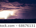 Night landscape on a background of thunderstorms. 68676131