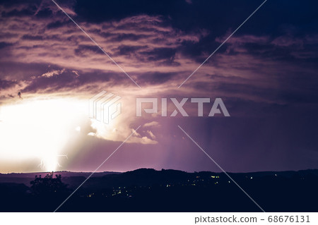 Night landscape on a background of thunderstorms. 68676131