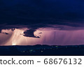 Night landscape on a background of thunderstorms. 68676132
