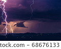 Night landscape on a background of thunderstorms. 68676133