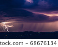 Night landscape on a background of thunderstorms. 68676134