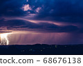 Night landscape on a background of thunderstorms. 68676138