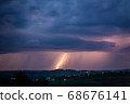 Night landscape on a background of thunderstorms. 68676141
