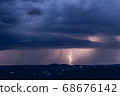 Night landscape on a background of thunderstorms. 68676142