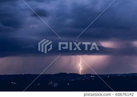 Night landscape on a background of thunderstorms. Night landscape on a background of thunderstorms. 68676142